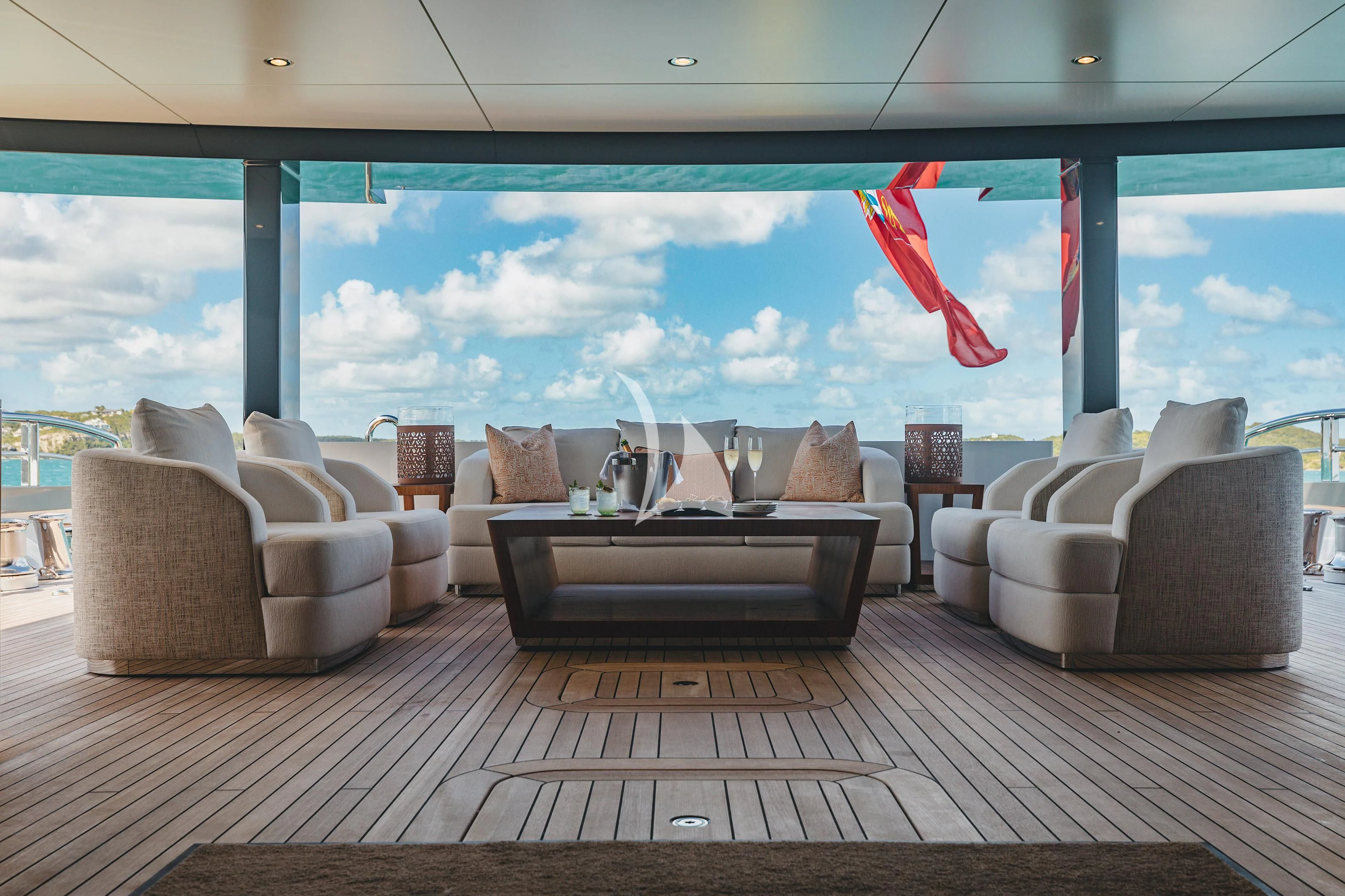a room with a large window and a wood floor with white couches and a wood floor and aboard COME TOGETHER Yacht for Charter