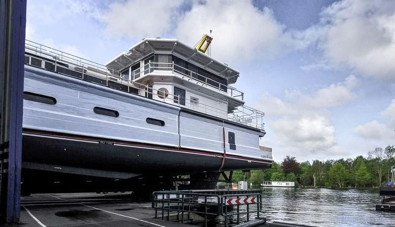 a large cruise ship docked aboard SHERPA Yacht for Sale