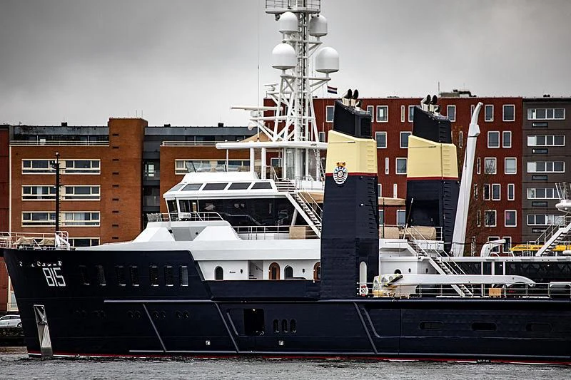 a large boat in front of a building aboard SHERPA Yacht for Sale
