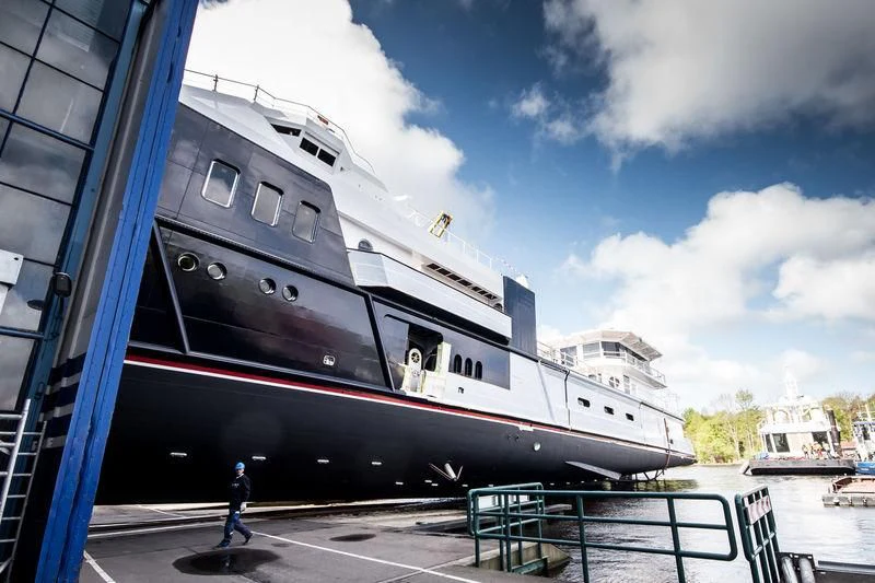 a large cruise ship docked aboard SHERPA Yacht for Sale