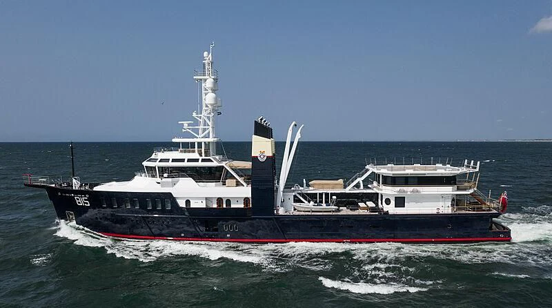 a large ship in the water aboard SHERPA Yacht for Sale