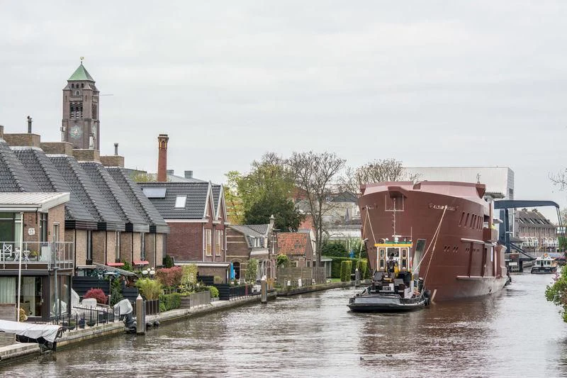 a boat is sailing in a canal aboard SHERPA Yacht for Sale