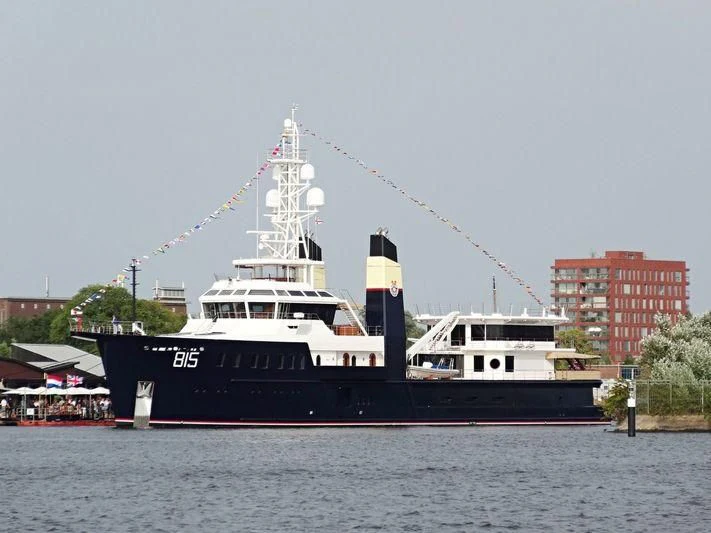 a large boat in the water aboard SHERPA Yacht for Sale