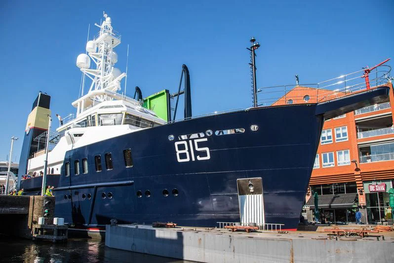 a large blue boat docked aboard SHERPA Yacht for Sale