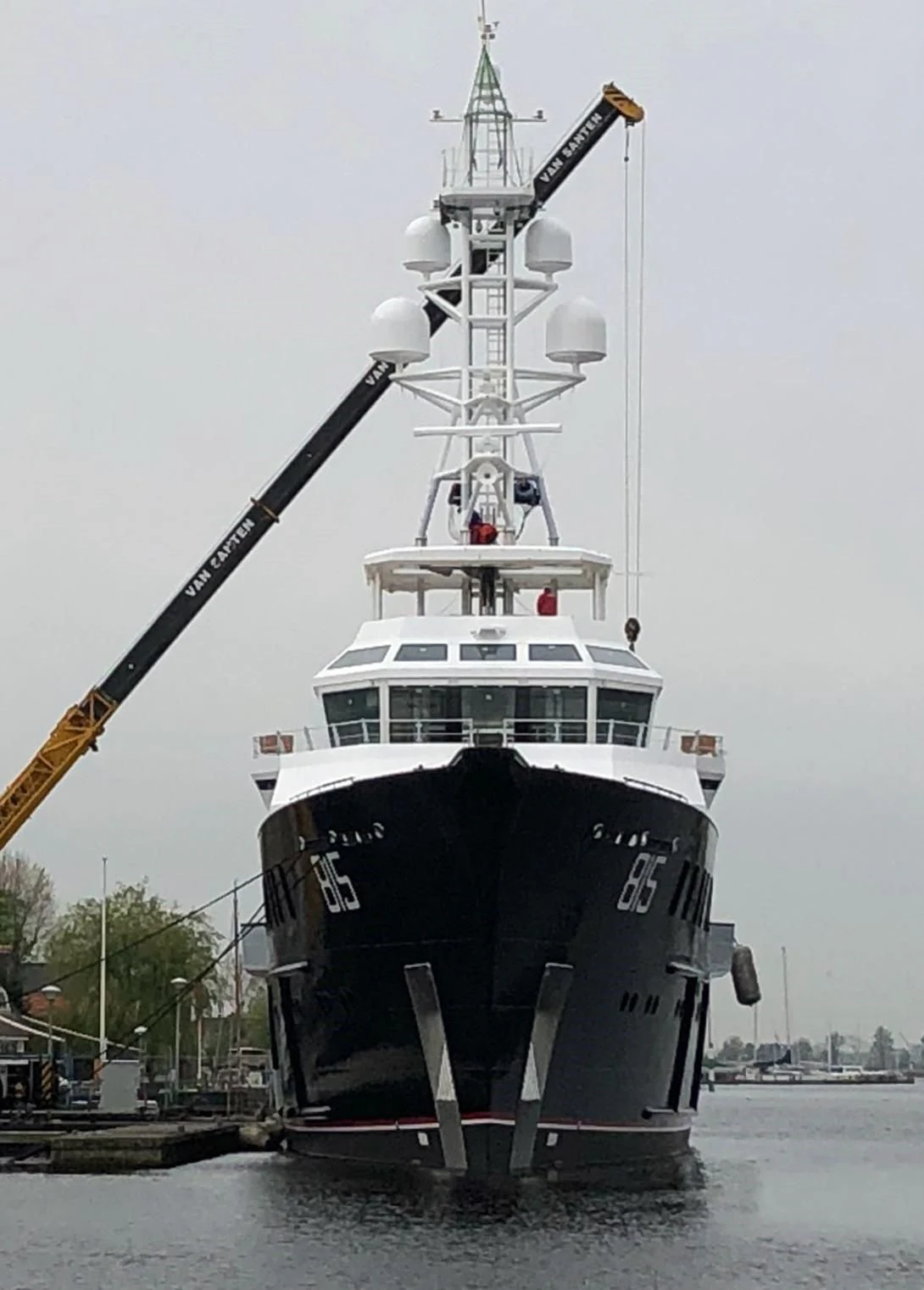 a boat with a crane on the back aboard SHERPA Yacht for Sale