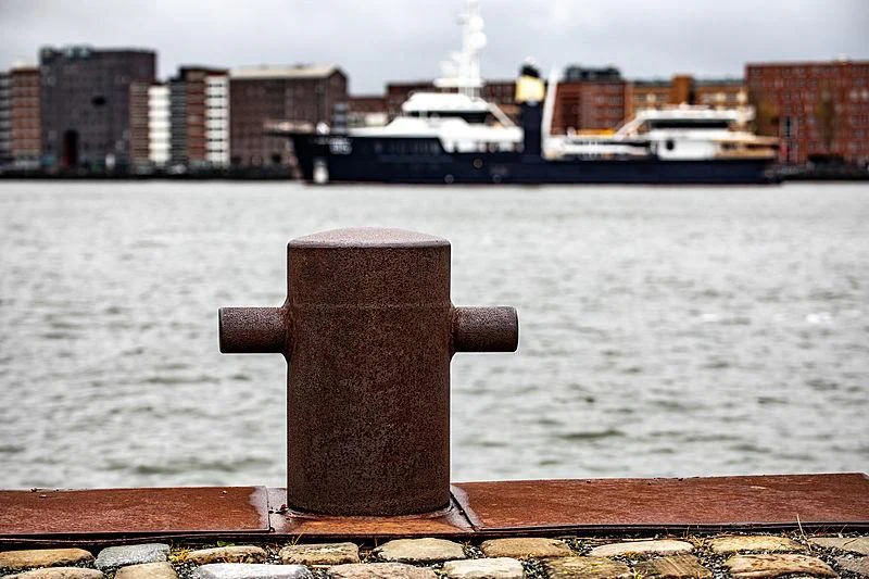 a statue of a person on a bridge over a body of water aboard SHERPA Yacht for Sale