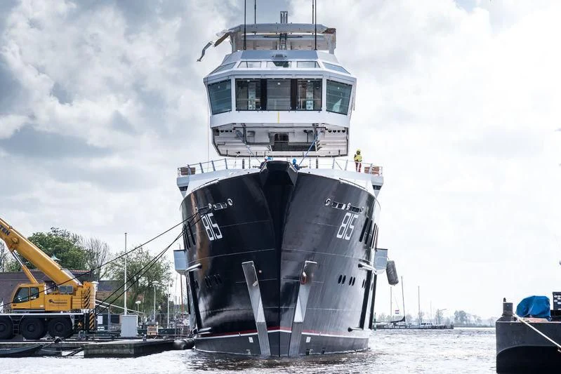 a large ship on a dock aboard SHERPA Yacht for Sale