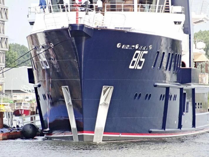 a large boat on the water aboard SHERPA Yacht for Sale