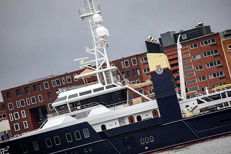 a large cruise ship docked aboard SHERPA Yacht for Sale