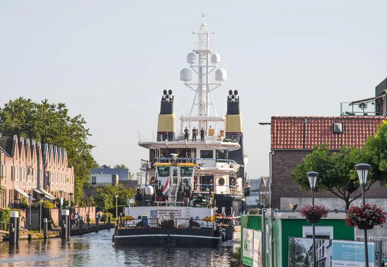 a large ship in a harbor aboard SHERPA Yacht for Sale