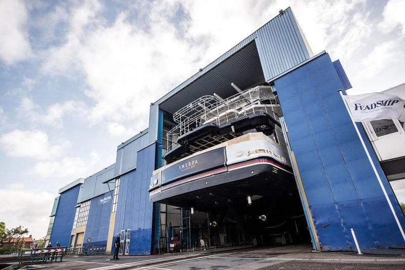 a building with a large glass front aboard SHERPA Yacht for Sale