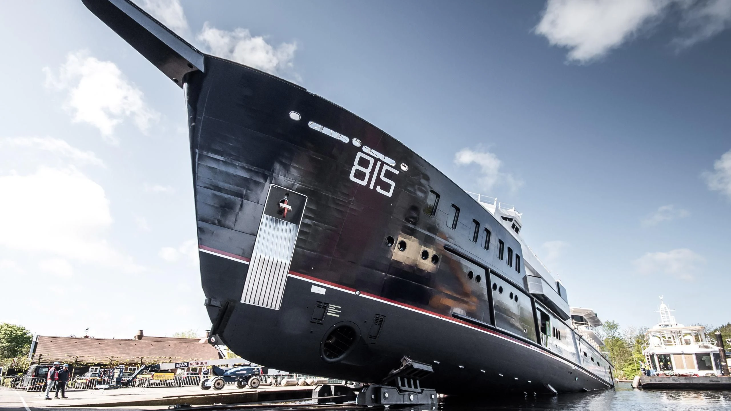 a large boat with a large ship on the water aboard SHERPA Yacht for Sale