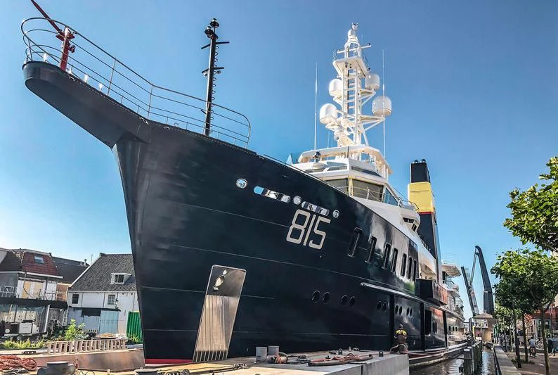 a large ship in a harbor aboard SHERPA Yacht for Sale