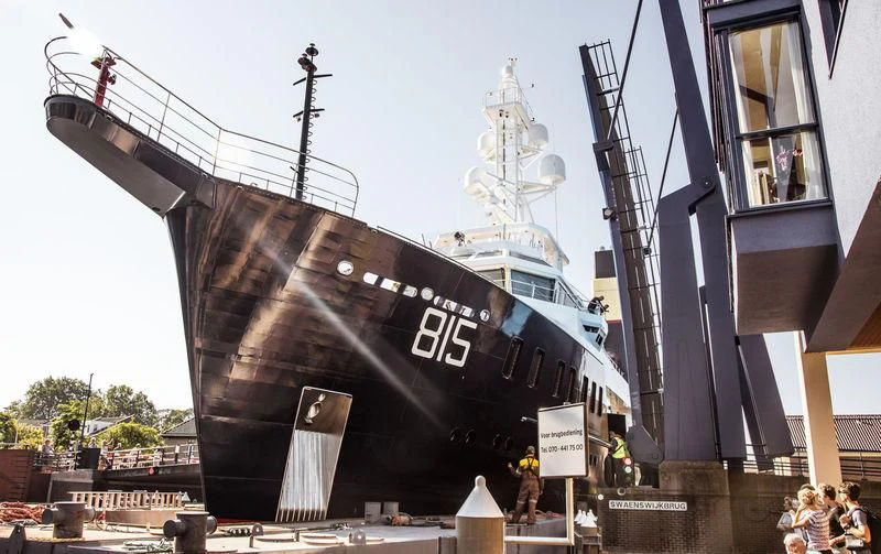 a large ship with a group of people around it aboard SHERPA Yacht for Sale