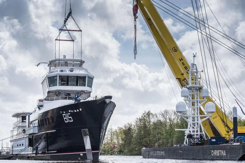 a large ship and a crane aboard SHERPA Yacht for Sale