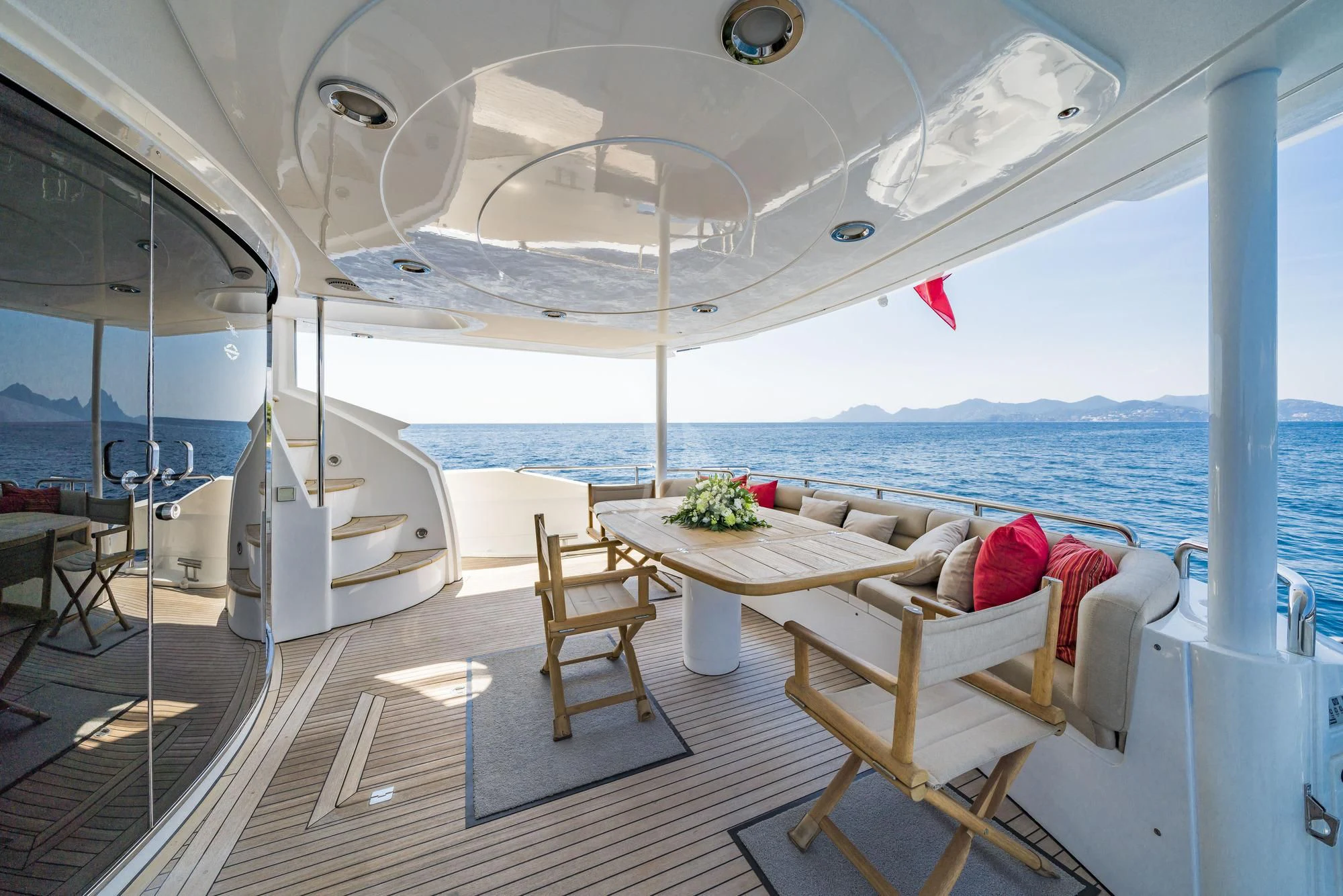 a room with a table and chairs aboard EXCELERATE Z Yacht for Sale