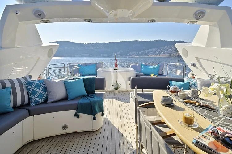 a boat with a table and chairs aboard EXCELERATE Z Yacht for Sale