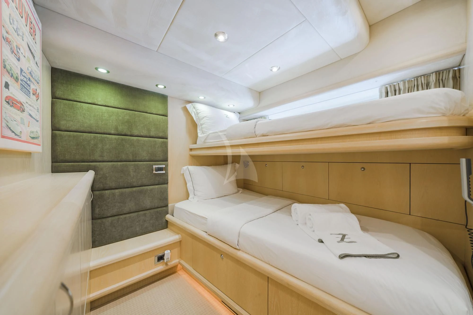 a room with a bed and a green wall aboard EXCELERATE Z Yacht for Sale