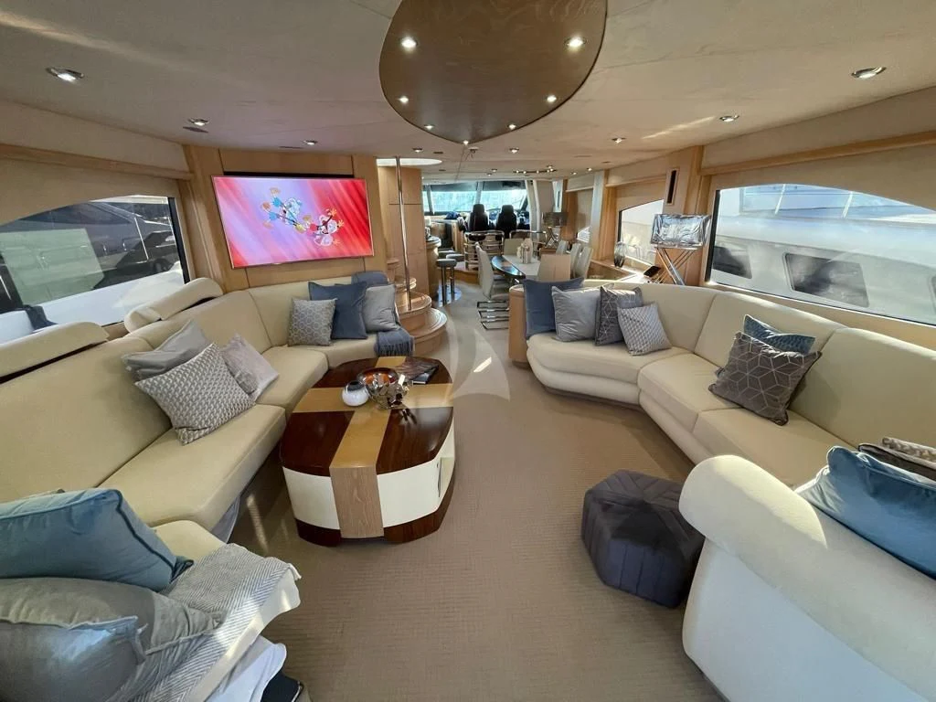 a living room with a large window aboard EXCELERATE Z Yacht for Sale