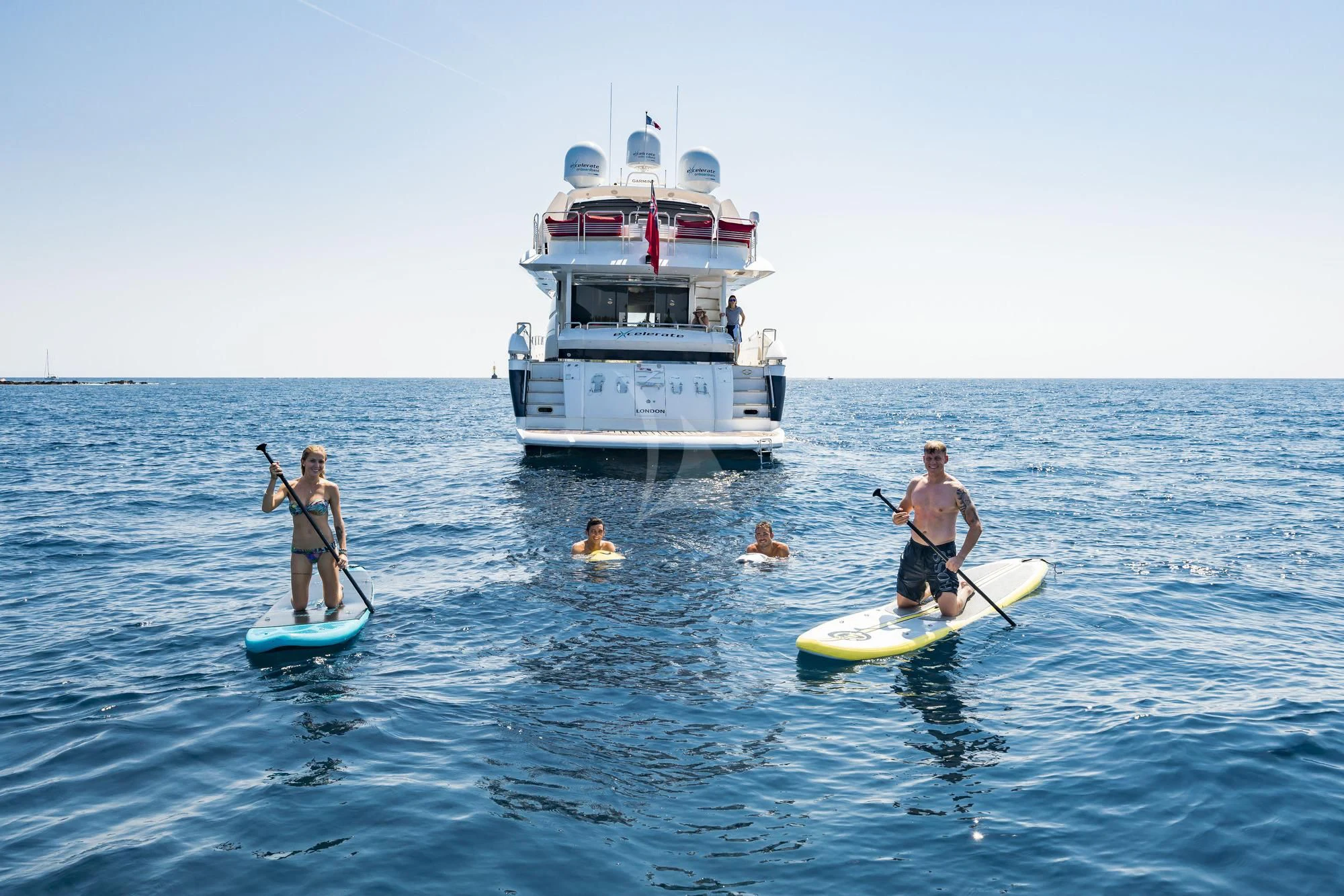 a group of people on surfboards in the ocean aboard EXCELERATE Z Yacht for Sale
