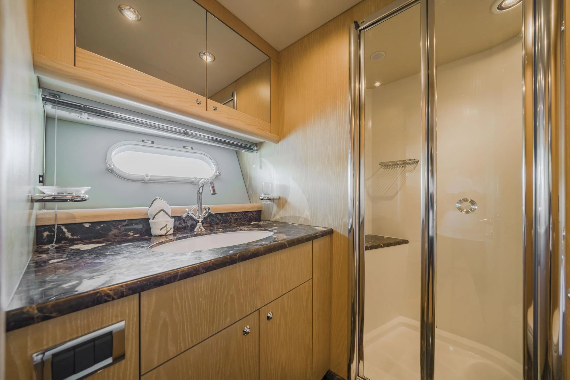 a bathroom with a glass shower aboard EXCELERATE Z Yacht for Sale