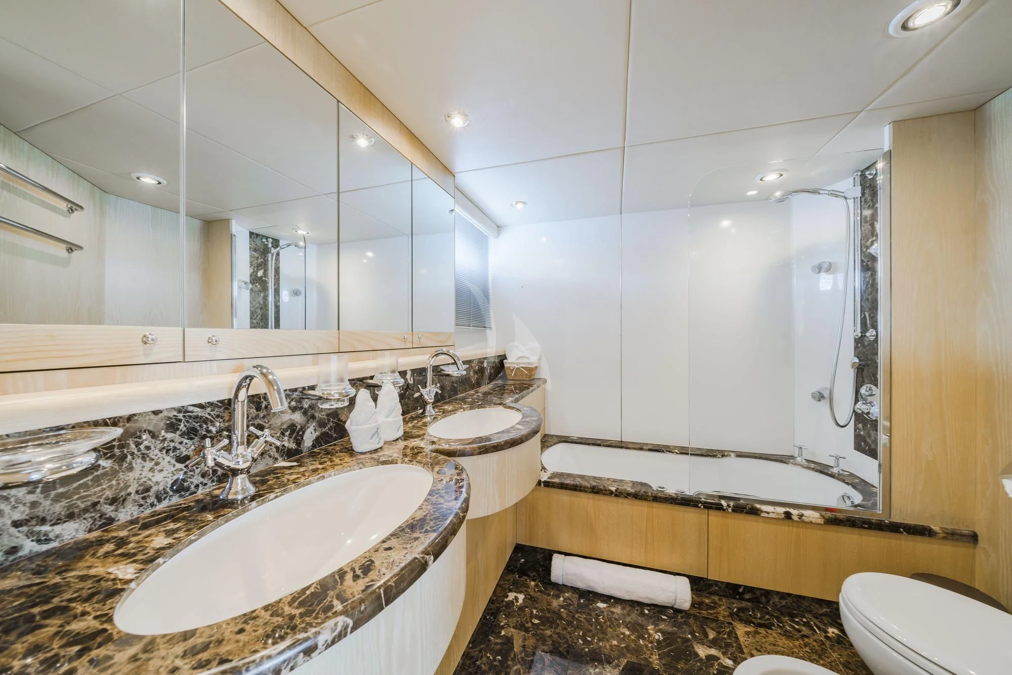 a bathroom with a sink and a mirror aboard EXCELERATE Z Yacht for Sale