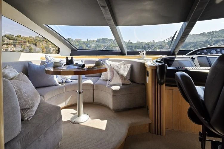 a living room with a couch and a table aboard EXCELERATE Z Yacht for Sale