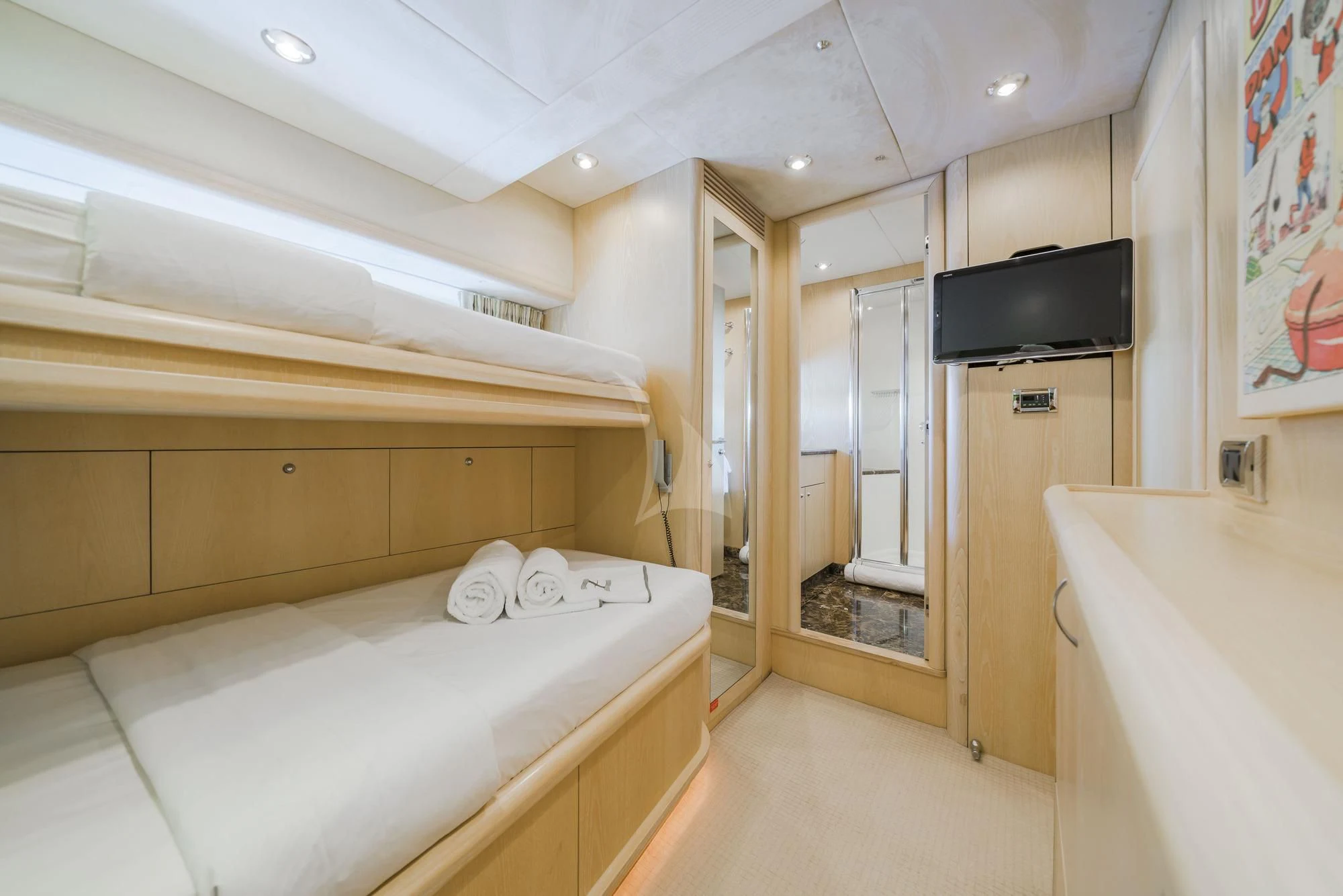 a bedroom with a bed and tv aboard EXCELERATE Z Yacht for Sale