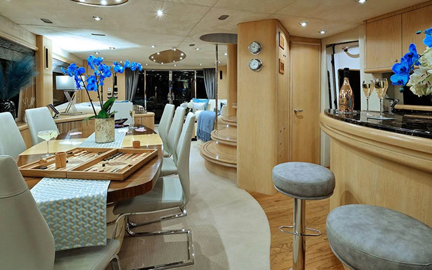 a room with a table and chairs aboard EXCELERATE Z Yacht for Sale