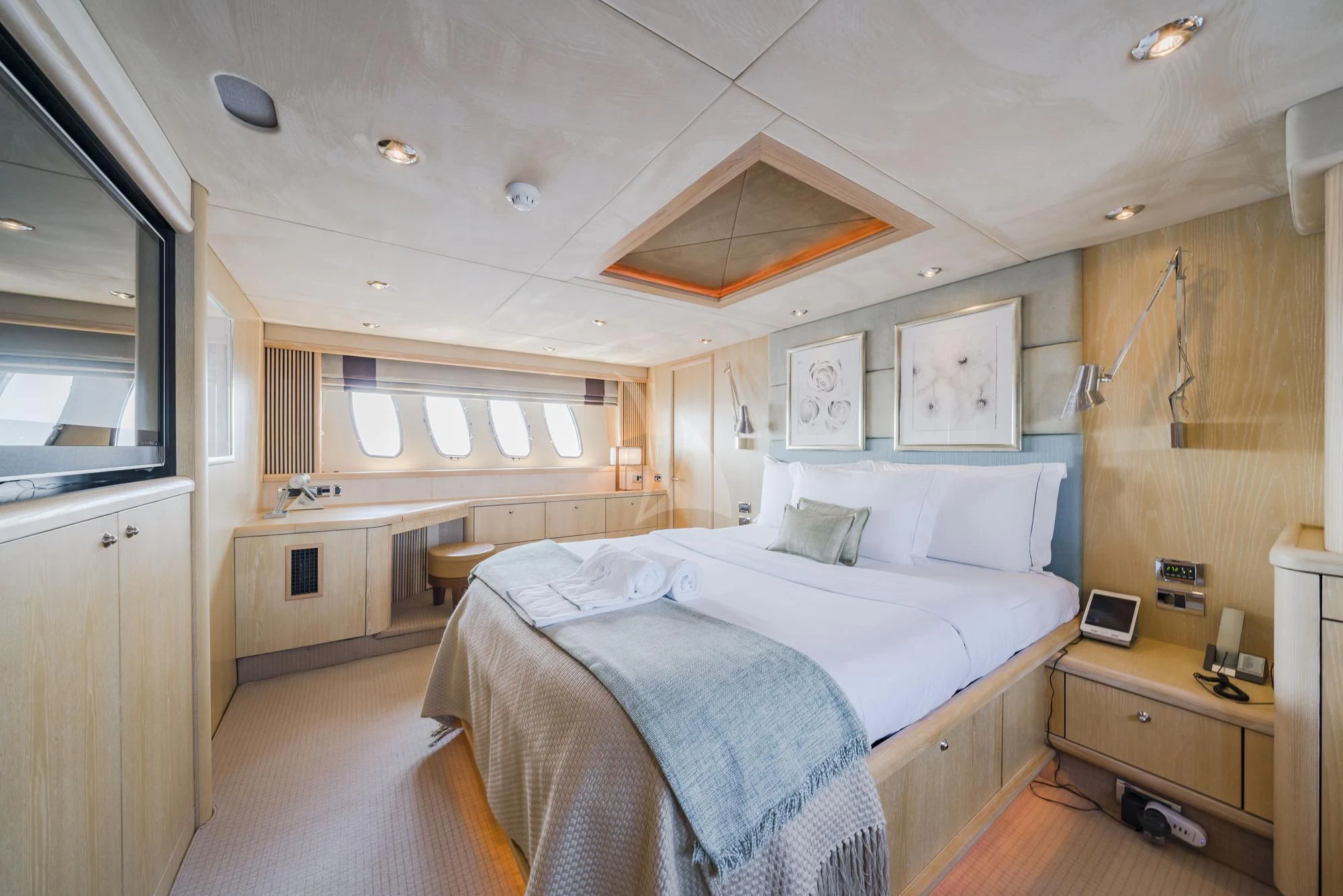 a bedroom with a bed and a fan aboard EXCELERATE Z Yacht for Sale