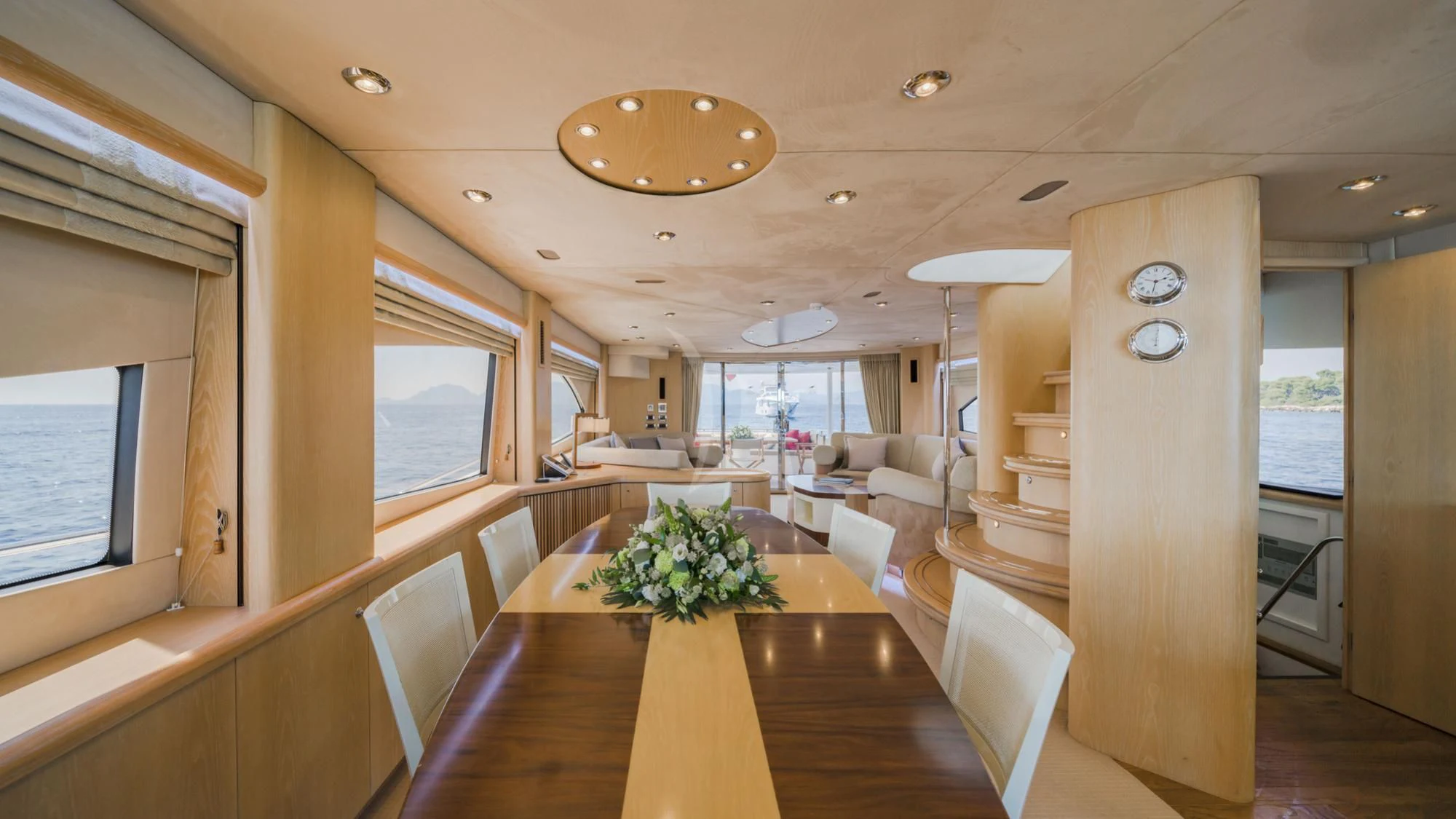 a room with a table and chairs aboard EXCELERATE Z Yacht for Sale