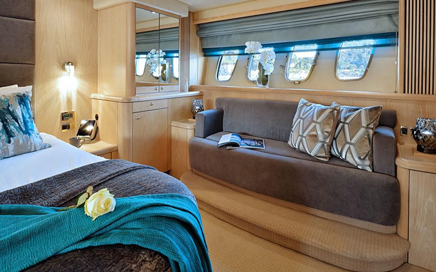 a living room with a couch and a bed aboard EXCELERATE Z Yacht for Sale