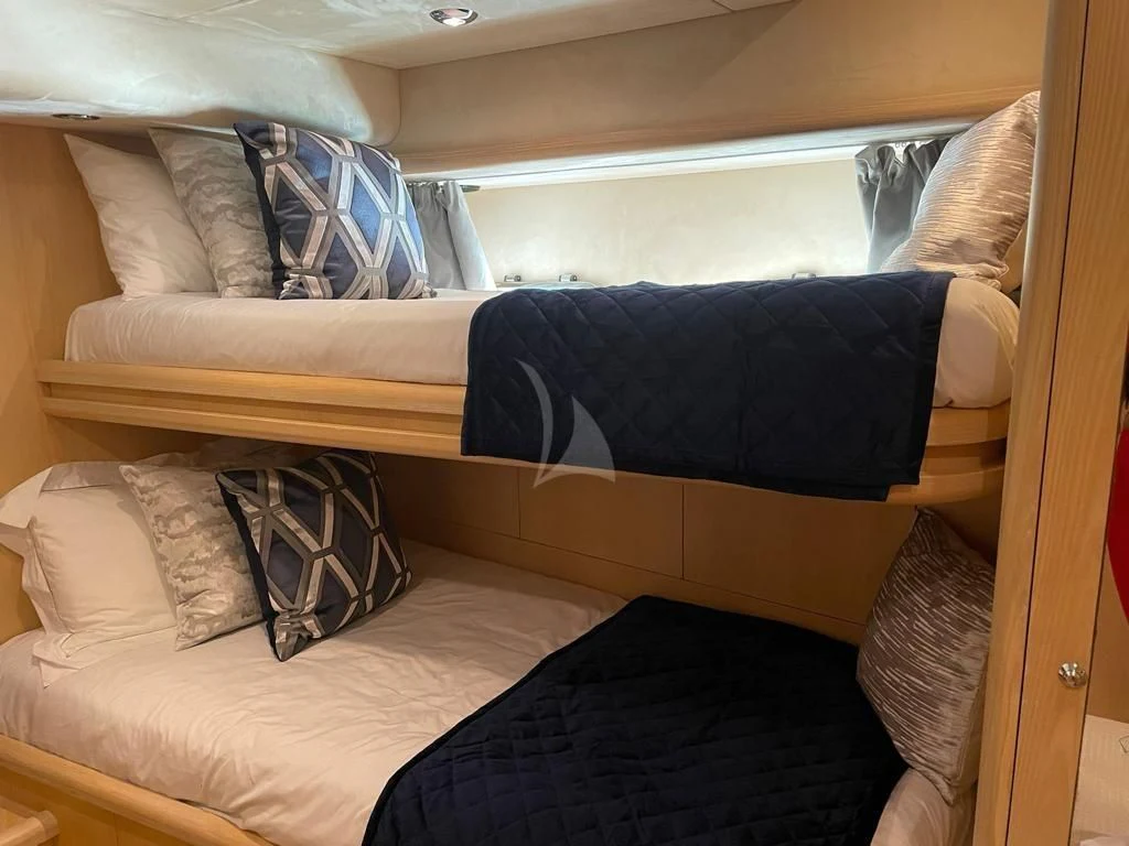 a bed with pillows aboard EXCELERATE Z Yacht for Sale
