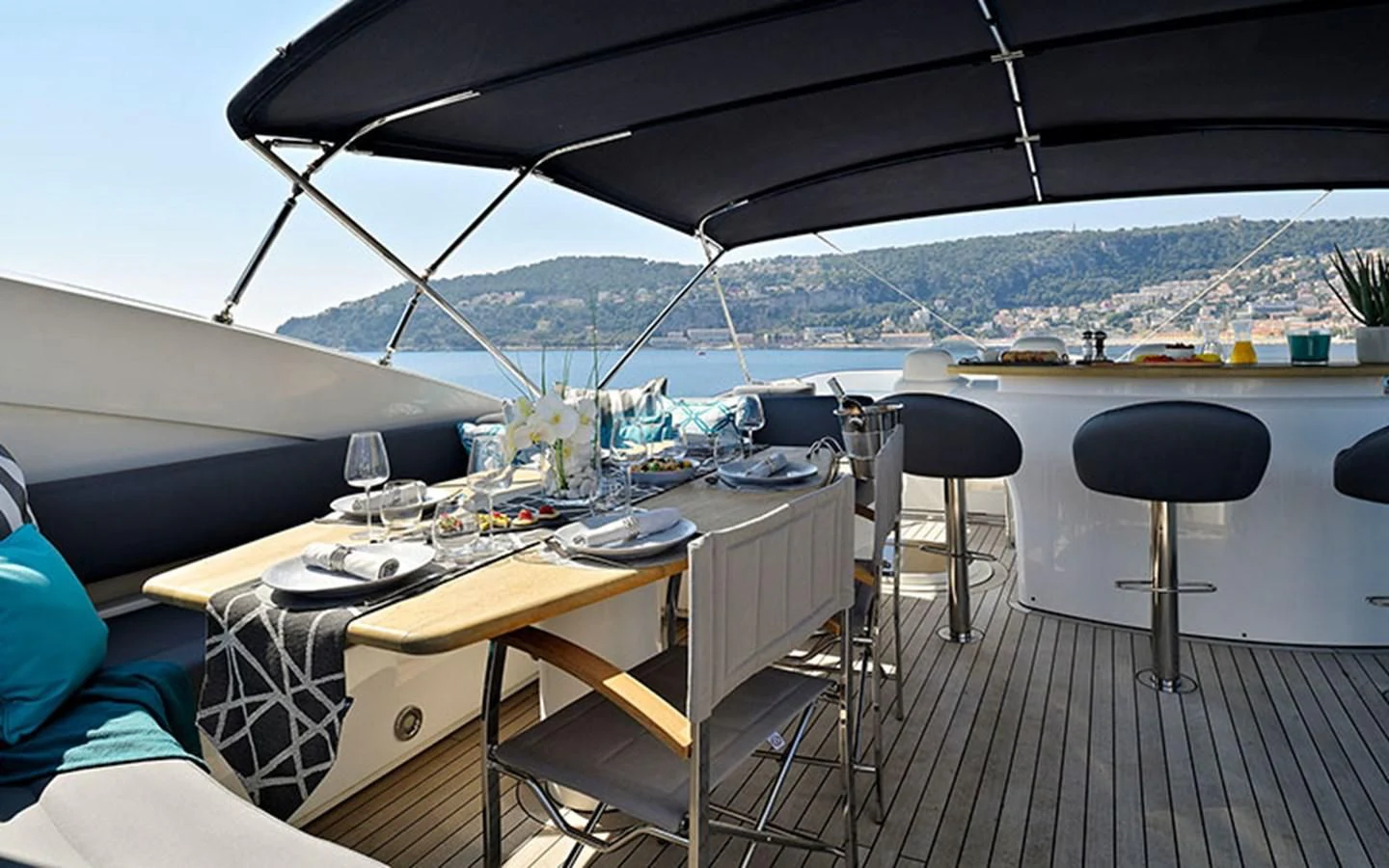 a table with chairs on it aboard EXCELERATE Z Yacht for Sale