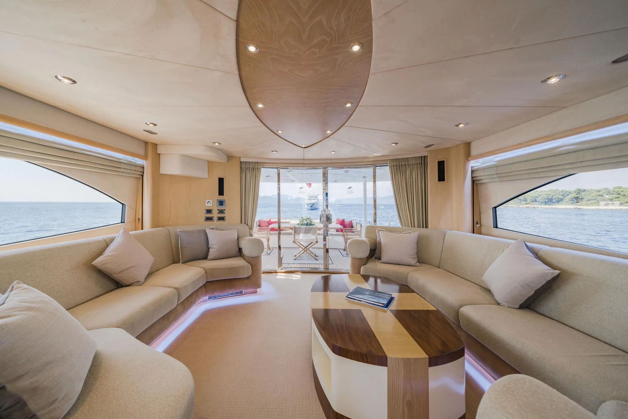 a living room with a large window aboard EXCELERATE Z Yacht for Sale