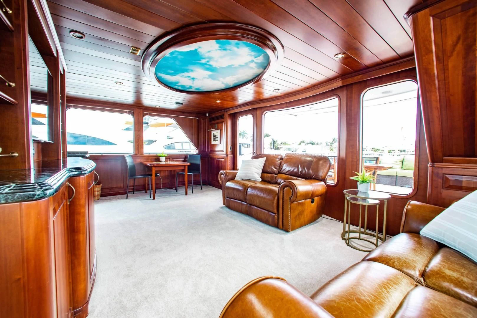 a living room with a large window aboard DRIVEN Yacht for Sale