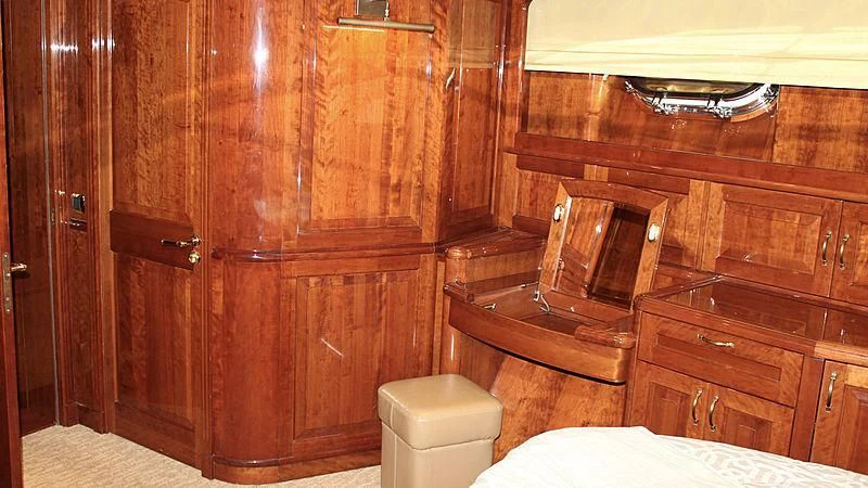 a wooden cabinet with a toilet aboard DRIVEN Yacht for Sale