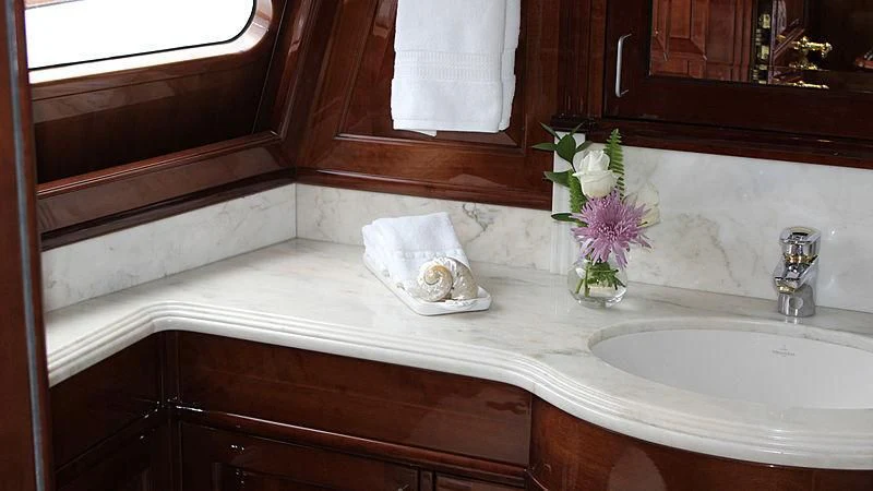 a bathroom with a sink and a mirror aboard DRIVEN Yacht for Sale