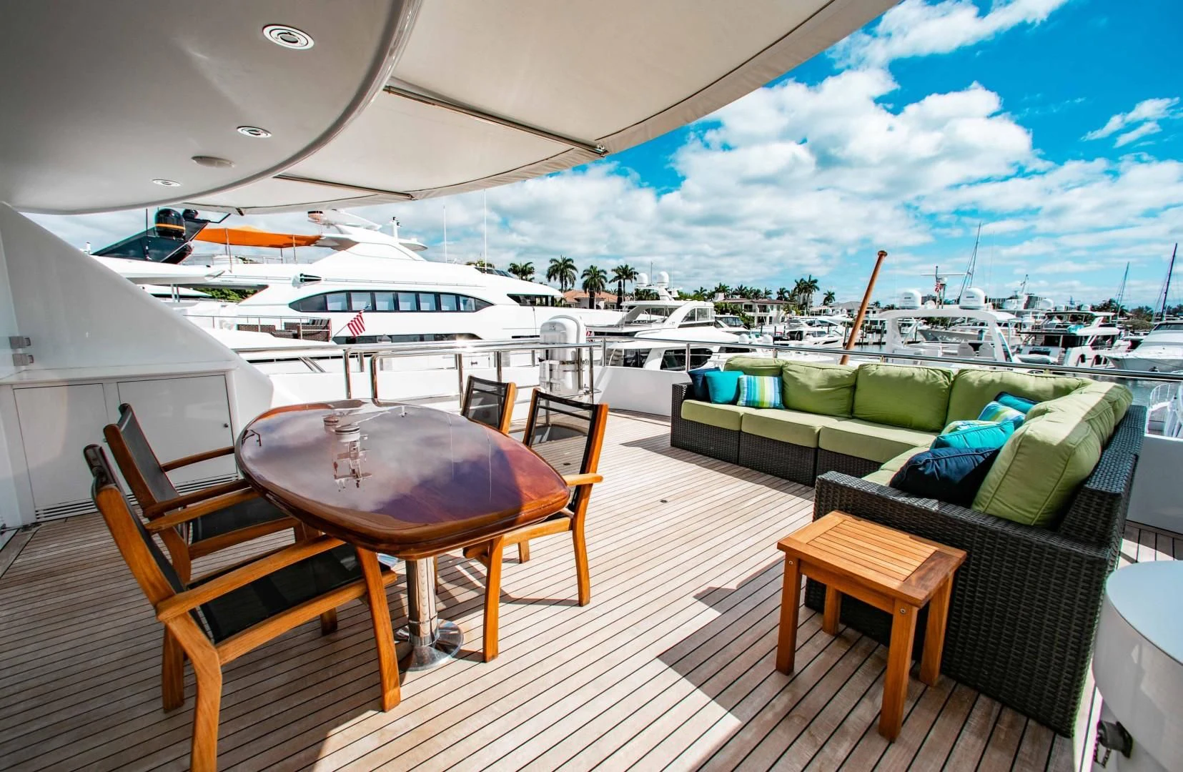 a table and chairs on a deck aboard DRIVEN Yacht for Sale