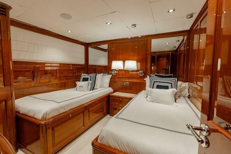 a room with two beds aboard DRIVEN Yacht for Sale