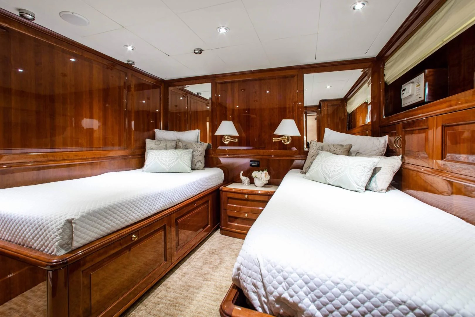 a room with two beds aboard DRIVEN Yacht for Sale