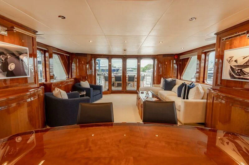 a living room with a wood floor aboard DRIVEN Yacht for Sale