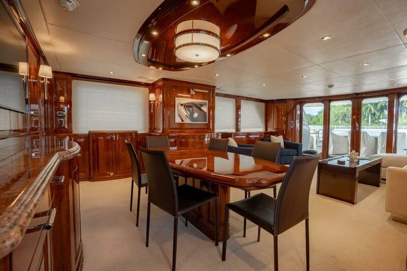 a large dining room with a table and chairs aboard DRIVEN Yacht for Sale