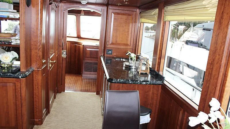 a kitchen with a counter and cabinets aboard DRIVEN Yacht for Sale