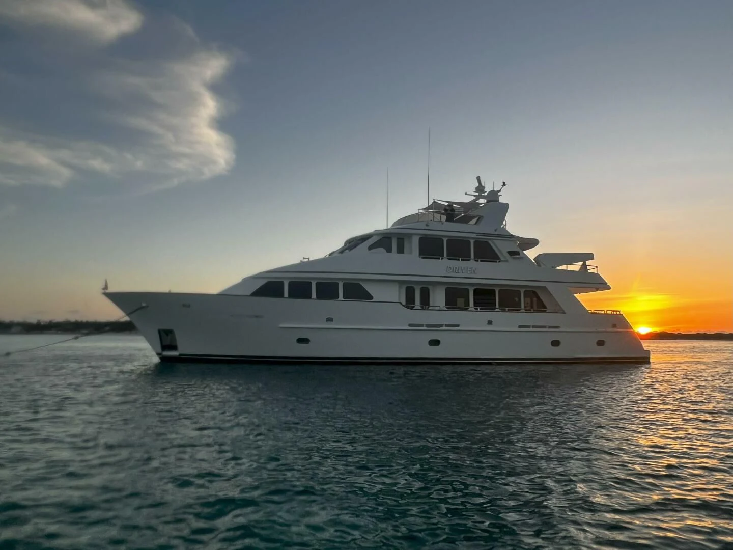 a white yacht in the water aboard DRIVEN Yacht for Sale