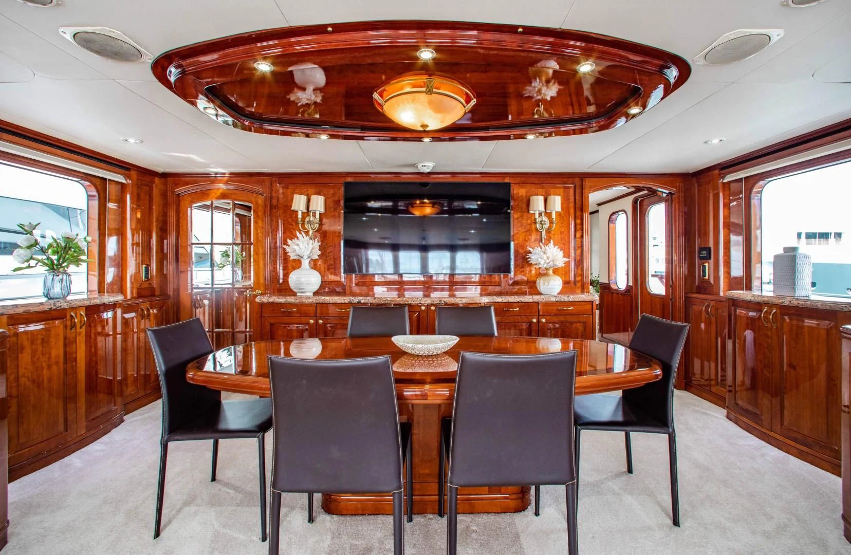 a dining room with a table and chairs aboard DRIVEN Yacht for Sale