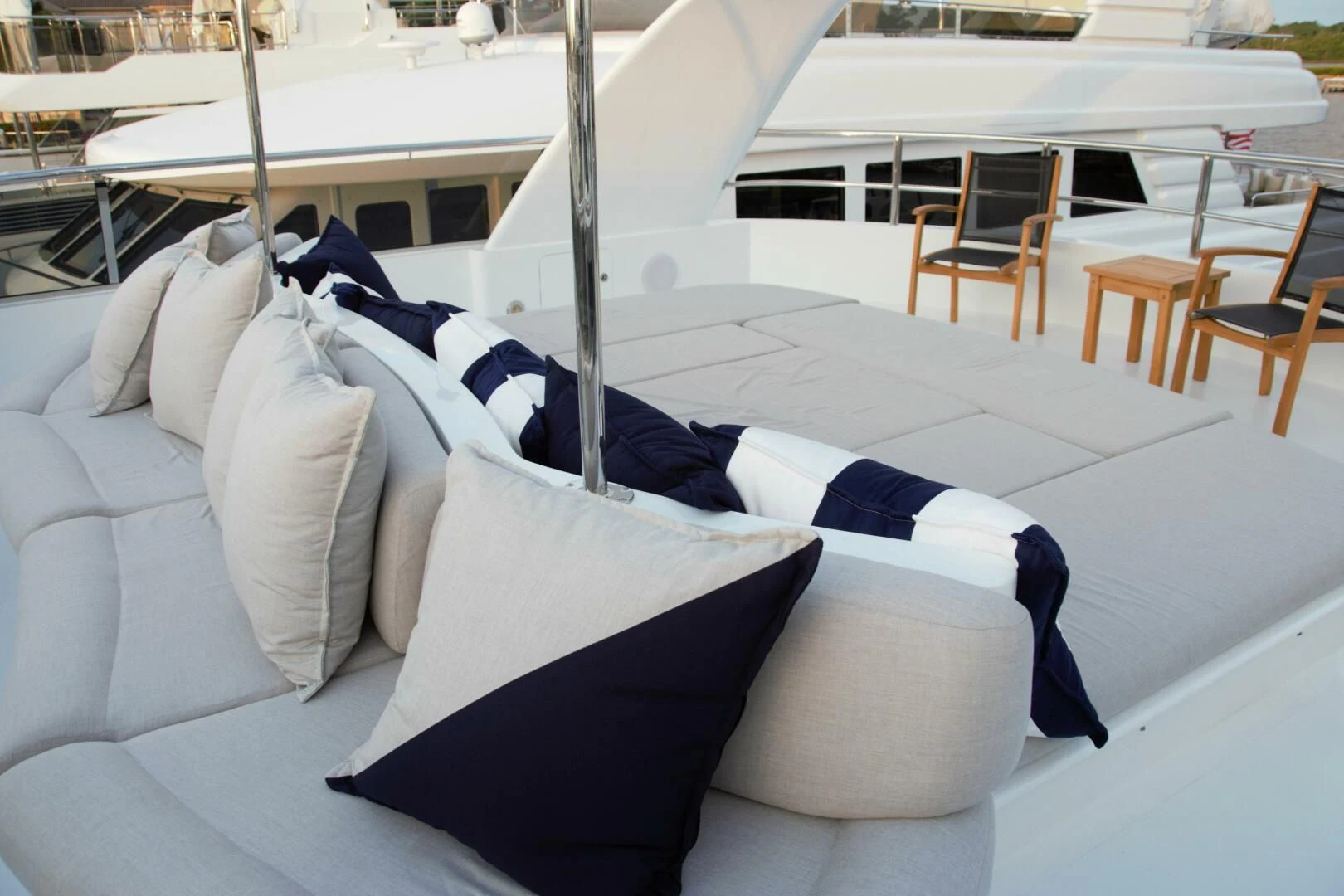 a white lounge chair next to a white lounge chair aboard DRIVEN Yacht for Sale