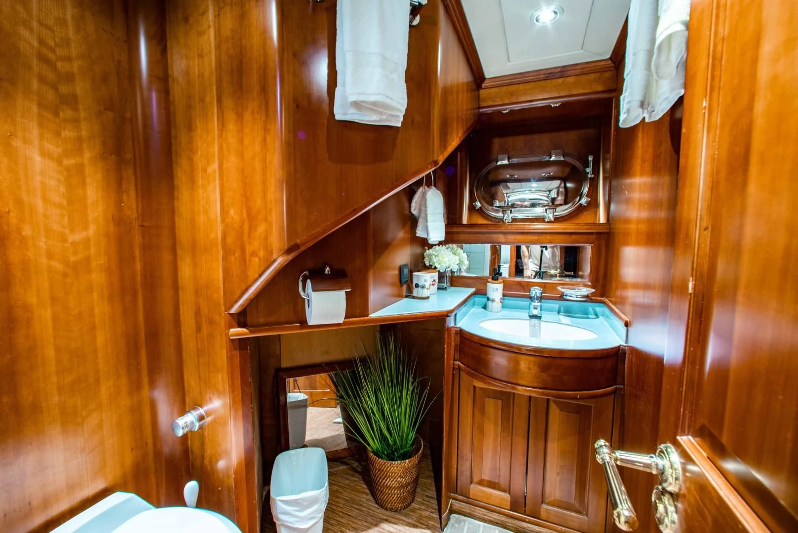 a bathroom with wooden walls aboard DRIVEN Yacht for Sale