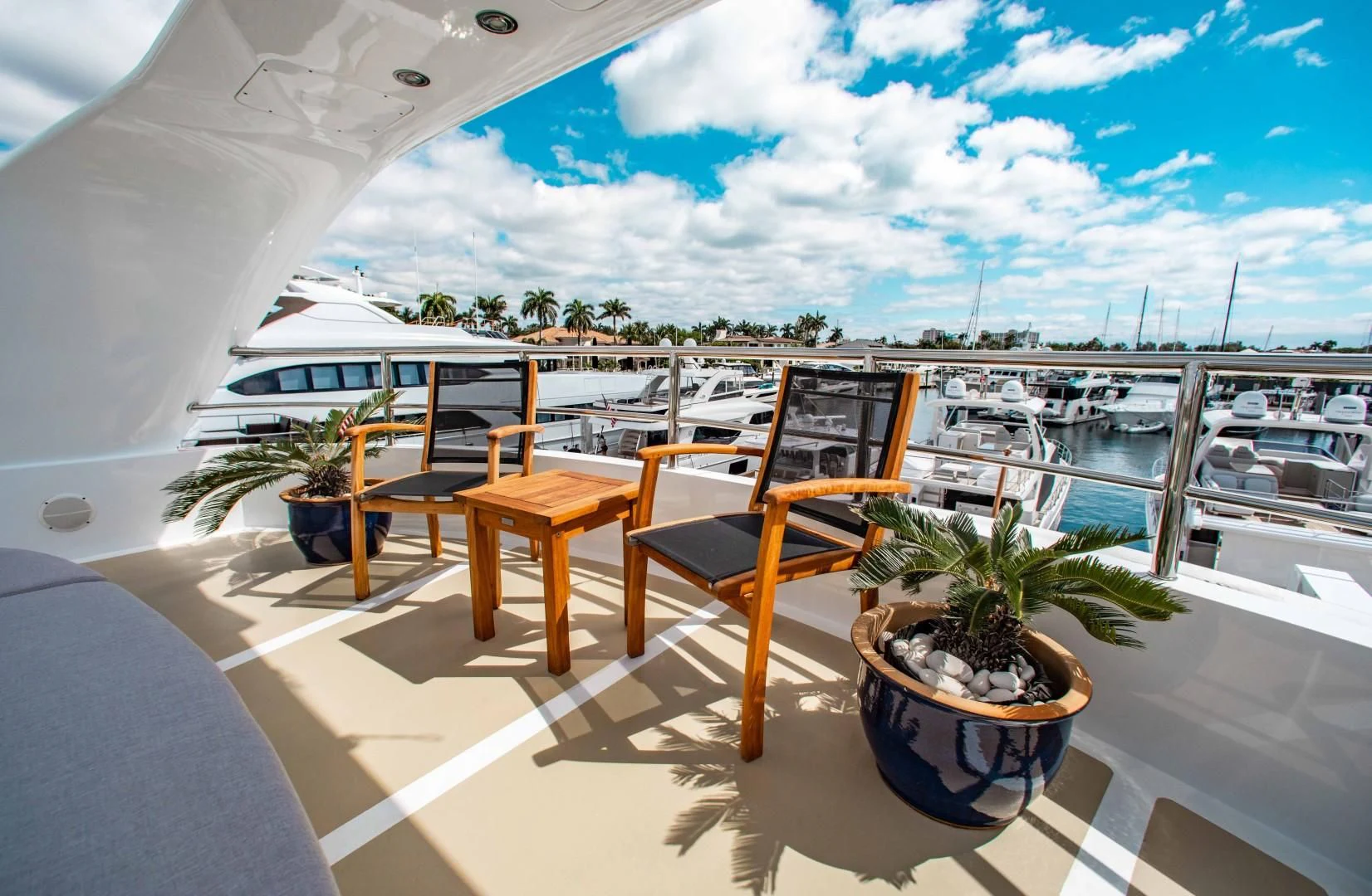 a table and chairs on a balcony aboard DRIVEN Yacht for Sale