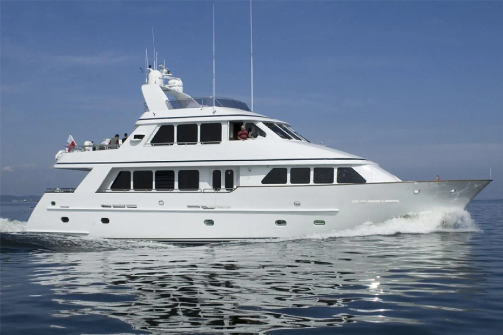 a white yacht on the water aboard DRIVEN Yacht for Sale